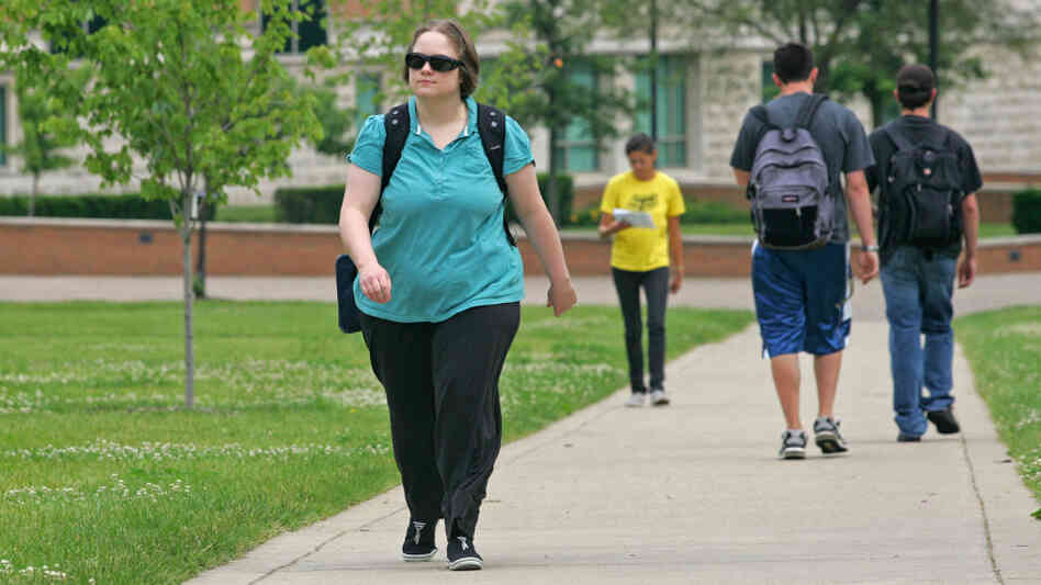 Lisa Daxer walks across the Wright State University campus. Lisa Daxer walks across the Wright State University campus.